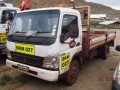 2007 Mitsubishi Fuso FE 7-115 With Dropsides 1